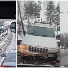 Vilniuje ant atitvaro pakibo džipas: vairuotojas – dingęs girto keleivio draugas? 