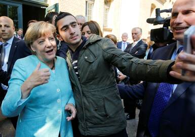 Anasas Modamani ir Angela Merkel