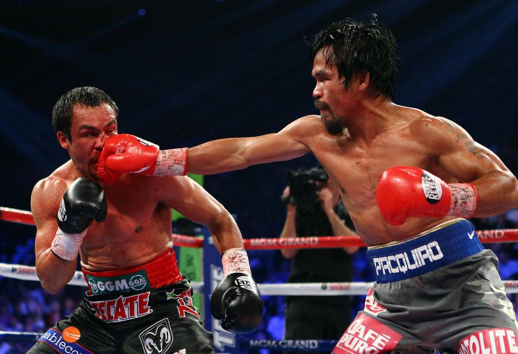 Įspūdingoje bokso kovoje Juanas Manuelis nokautavo Manny Pacquiao
