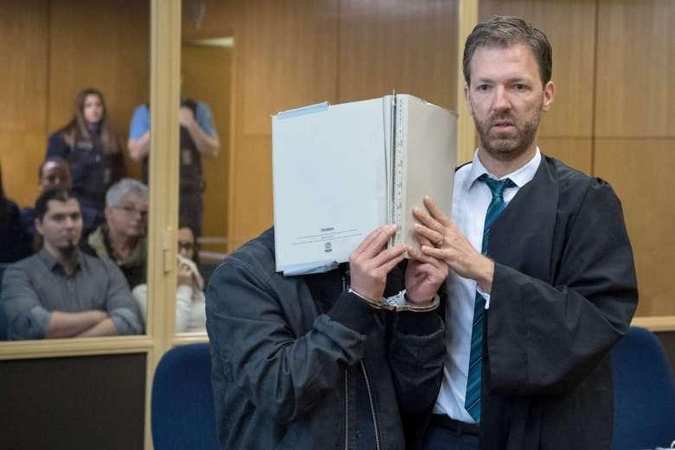 Dėl žiauraus nužudymo per egzorcizmo ritualą teisiami penki asmenys